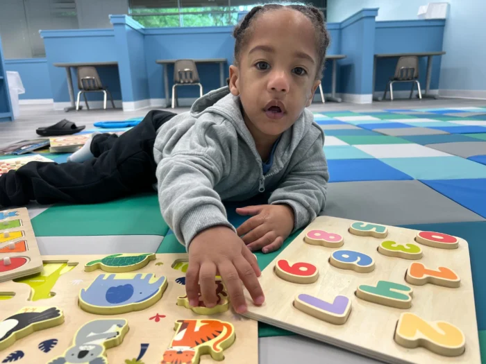 Abacus Therapies - ABA for Toddlers - a boy playing with wooden educational toys